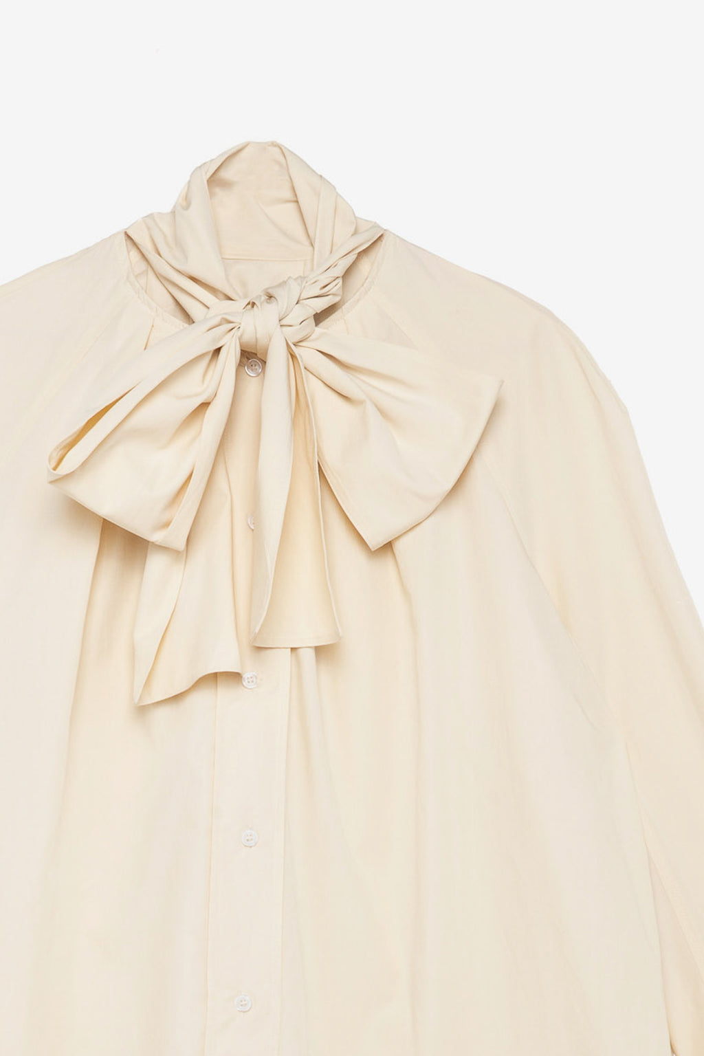 Cream blouse with a large bow 