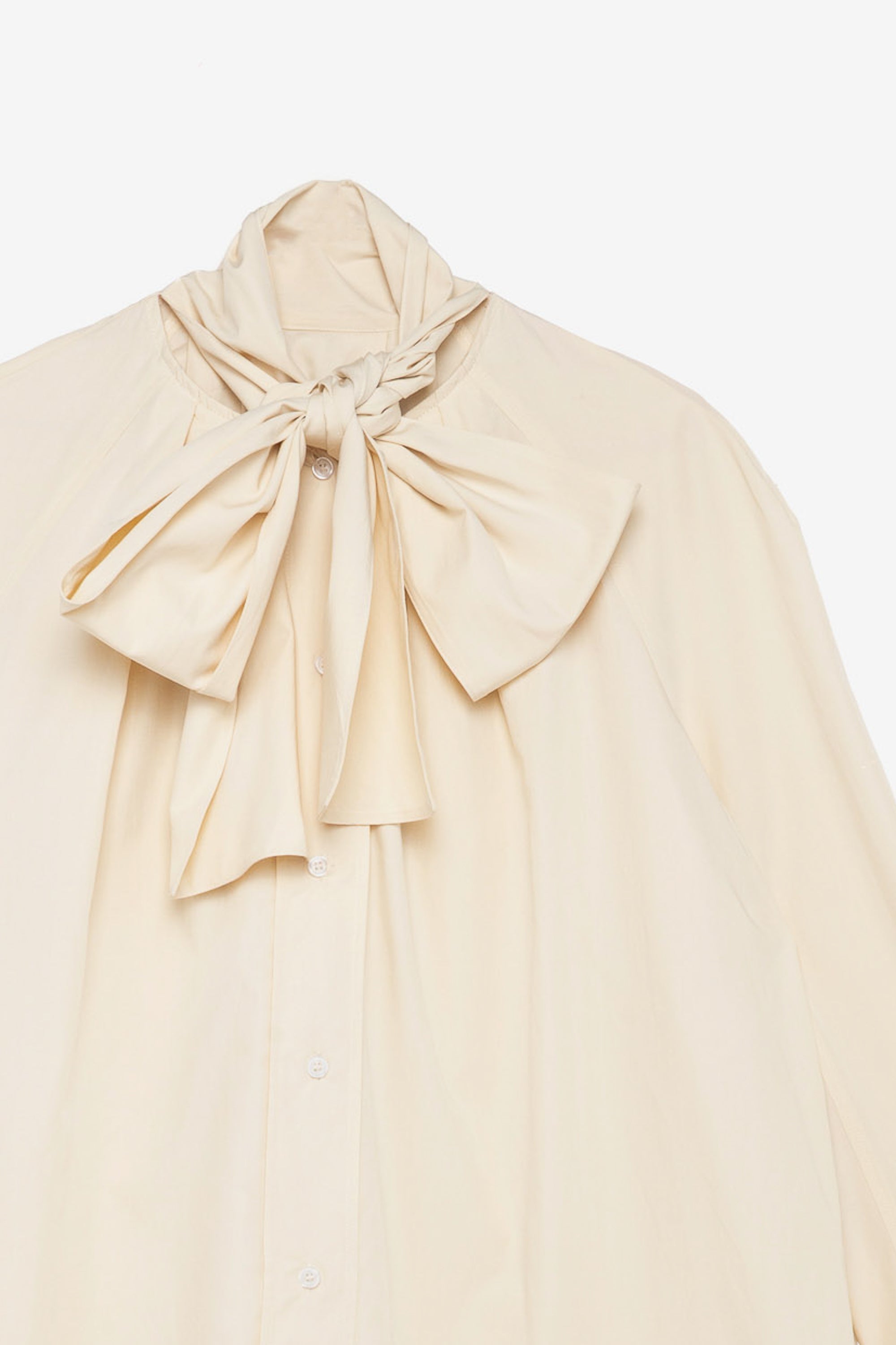 Cream blouse with a large bow 