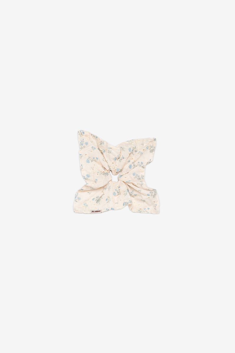 Floral scrunchi on a cream background