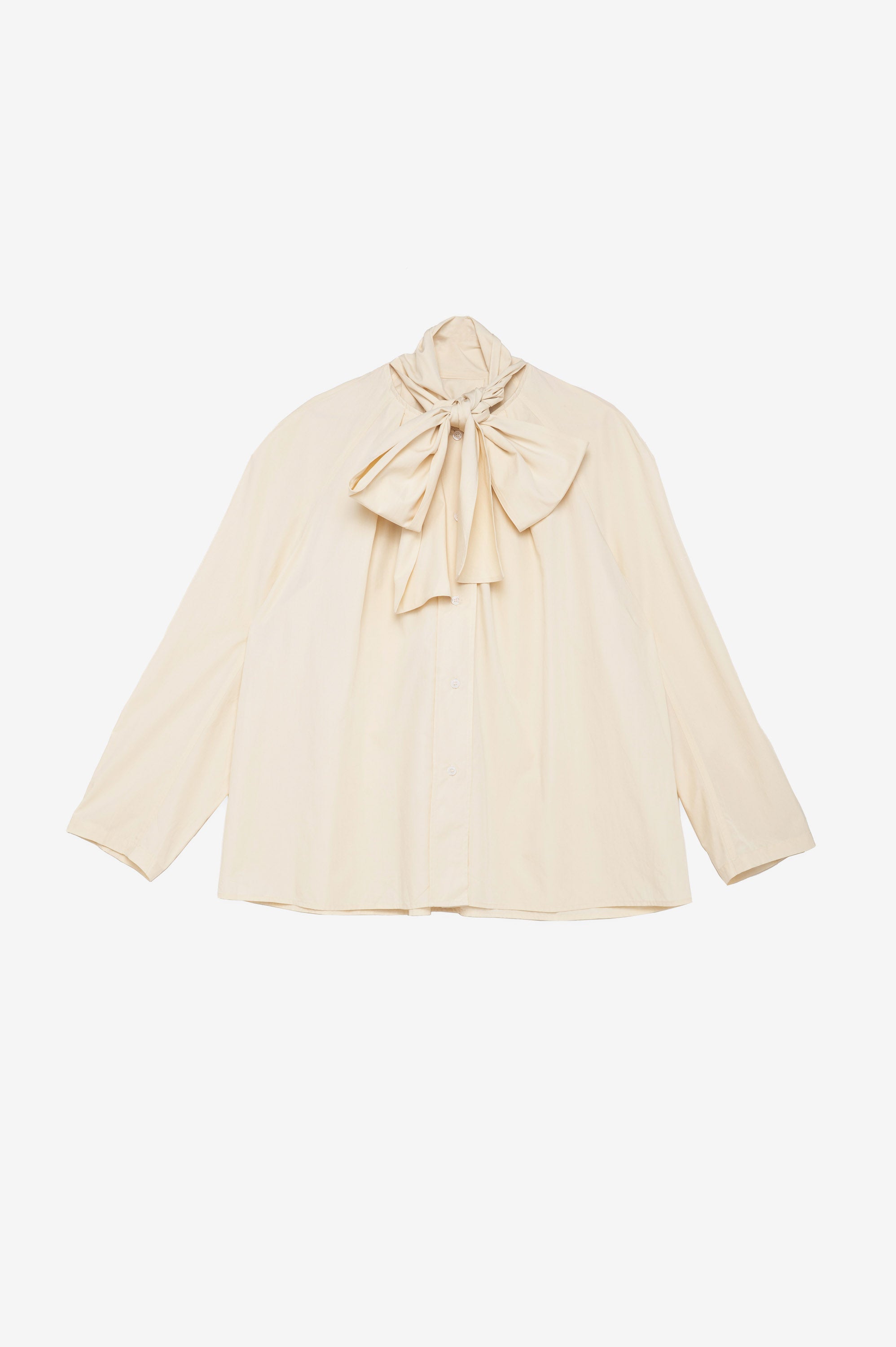 Cream blouse with a large bow 